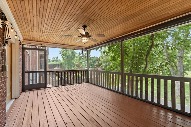 a view of a balcony with wooden floor