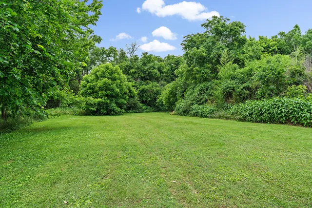 a view of outdoor space with deck and yard