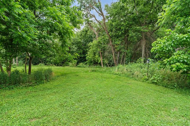 a view of a backyard with a garden