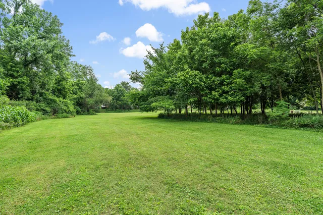 an aerial view of a house with a garden