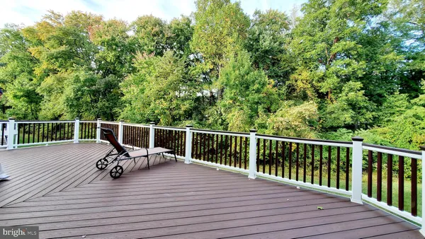 a view of a balcony with wooden floor