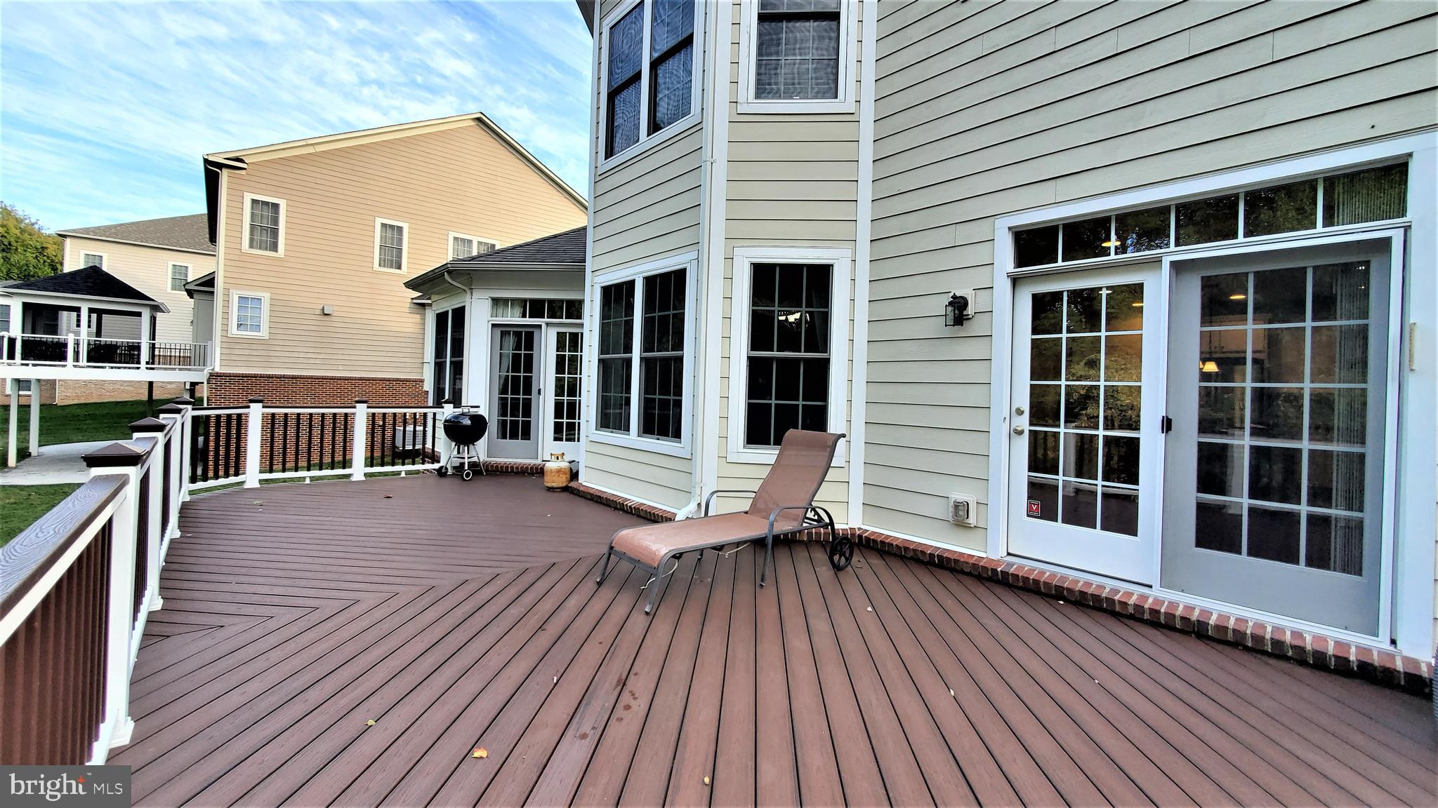12614 Winter Wren Court Herndon, VA 20171 - Photo 12 of 55 a view of a house with pool door and wooden floor