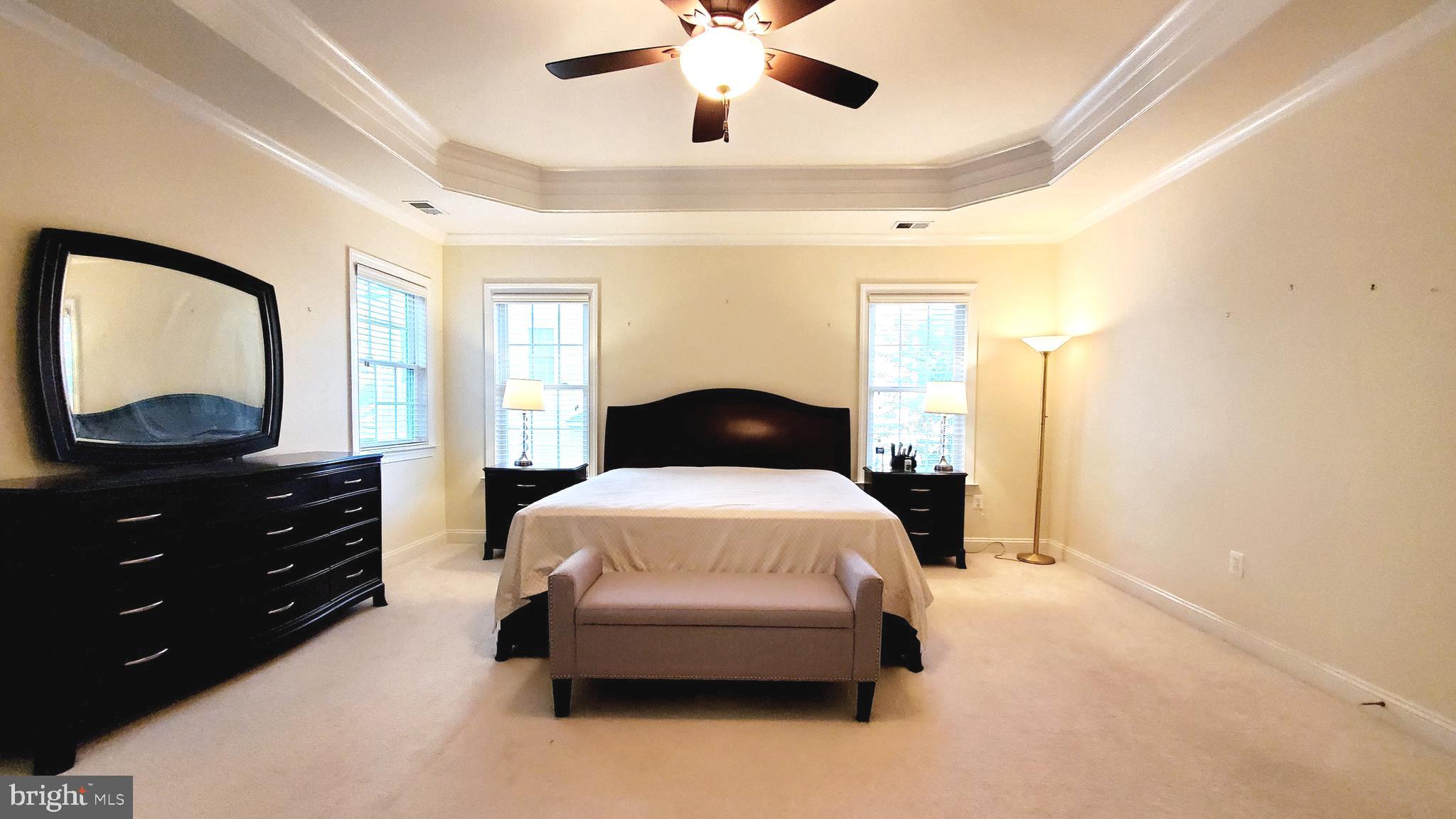 12614 Winter Wren Court Herndon, VA 20171 - Photo 29 of 55 a bedroom with a bed and a dresser