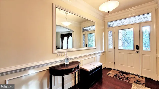 a living room with furniture a table and a large window