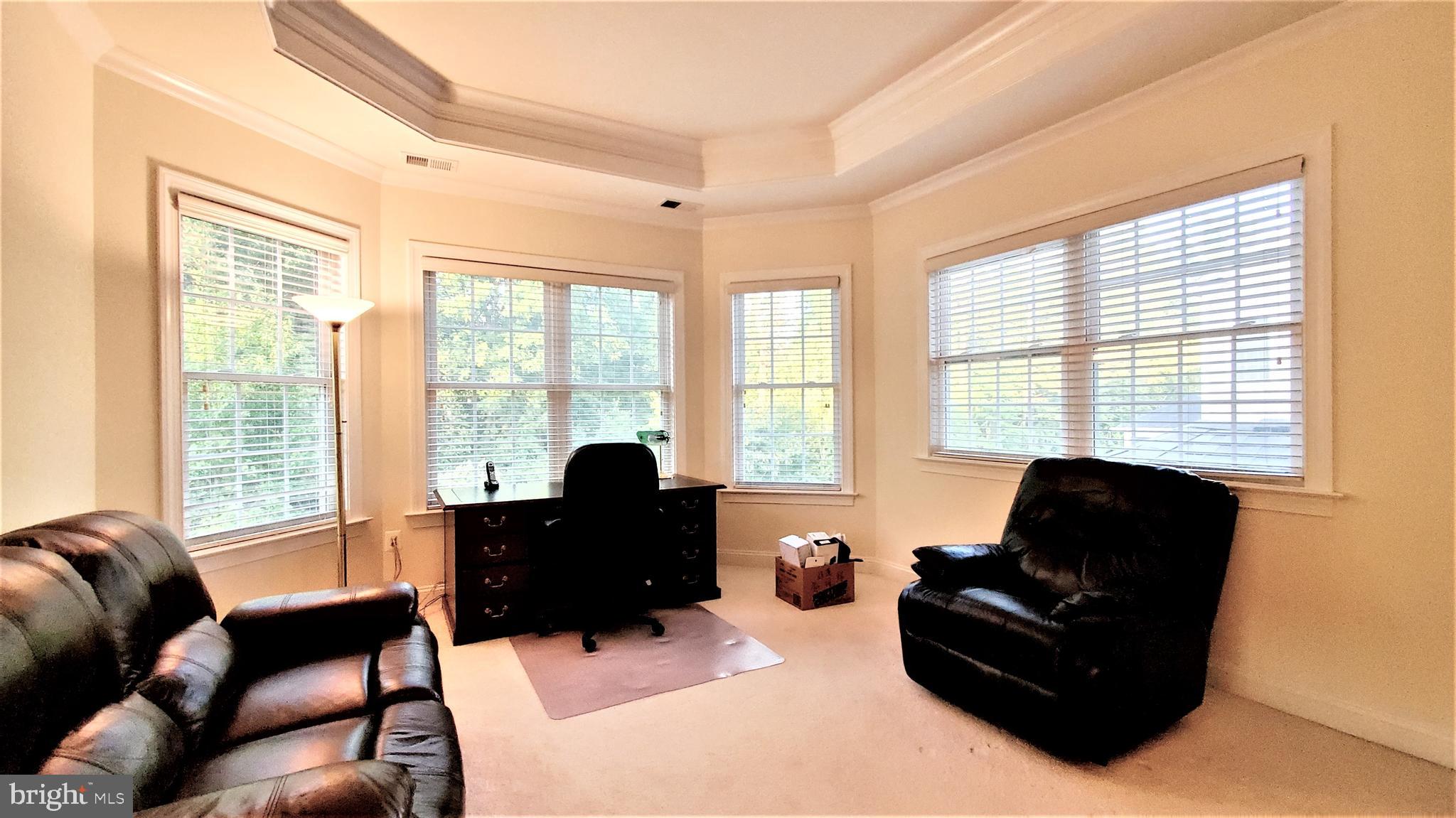 12614 Winter Wren Court Herndon, VA 20171 - Photo 32 of 55 a living room with furniture and a window