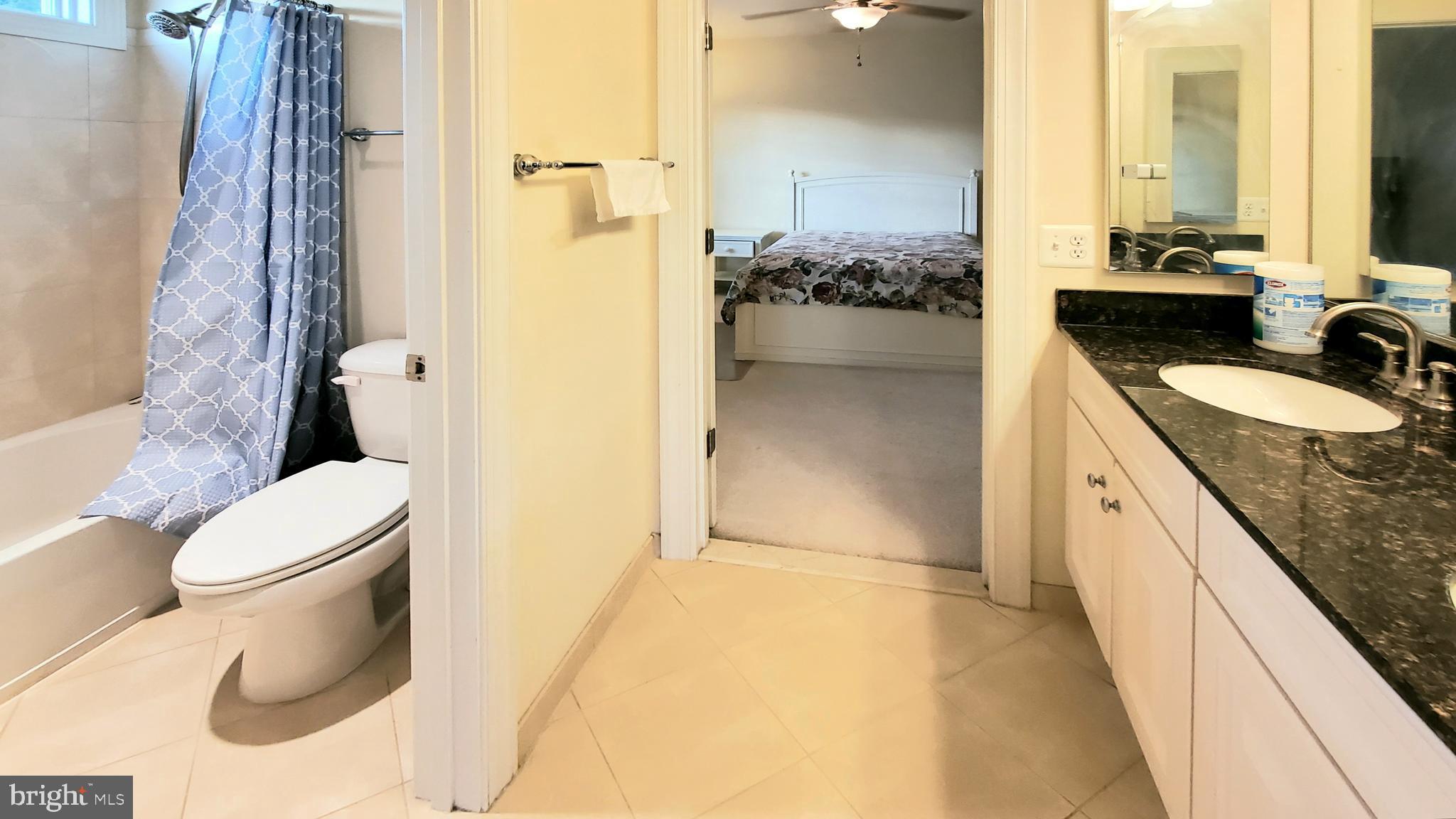 12614 Winter Wren Court Herndon, VA 20171 - Photo 45 of 55 a bathroom with a granite countertop sink toilet and shower