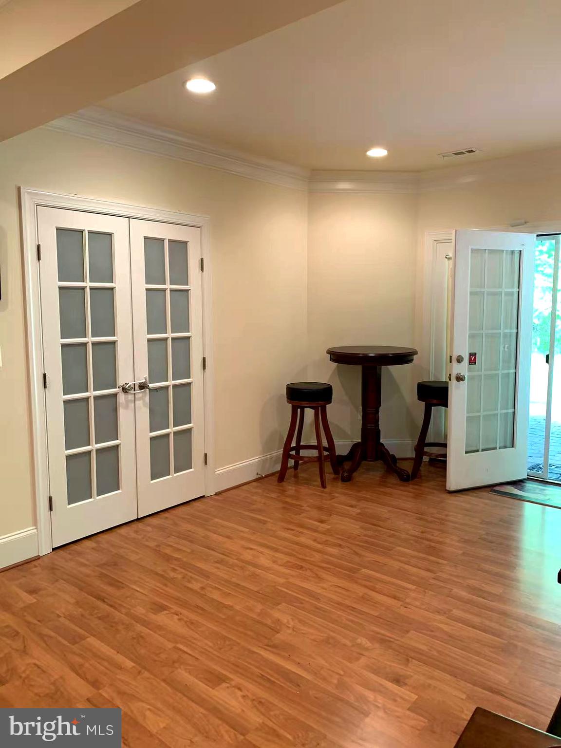12614 Winter Wren Court Herndon, VA 20171 - Photo 51 of 55 a view of an empty room with wooden floor and a window