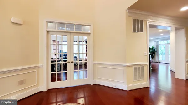 a view of a porch with furniture and front door