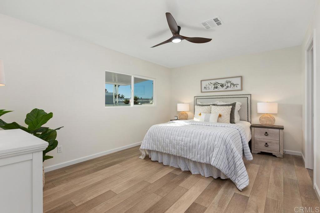 7144 Santa Rosa Carlsbad, CA 92011 - Photo 20 of 41 a bedroom with a bed and a window