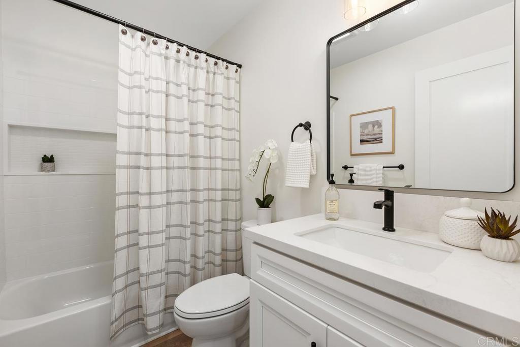 7144 Santa Rosa Carlsbad, CA 92011 - Photo 29 of 41 a bathroom with a sink toilet and shower