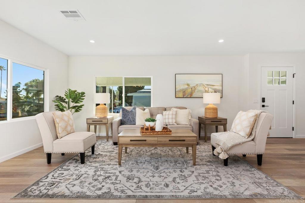 7144 Santa Rosa Carlsbad, CA 92011 - Photo 4 of 41 a living room with furniture and a rug