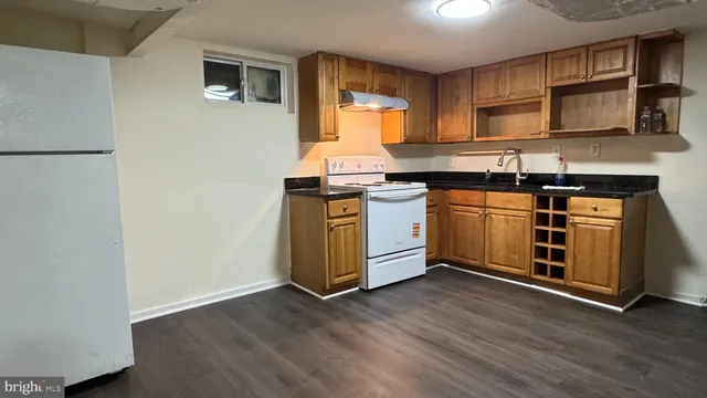 a utility room with a sink washer and dryer