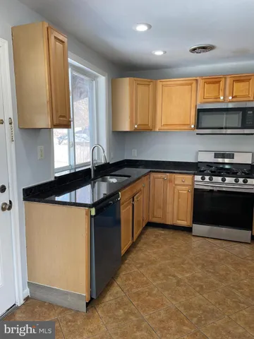 a view of an ocean & kitchen