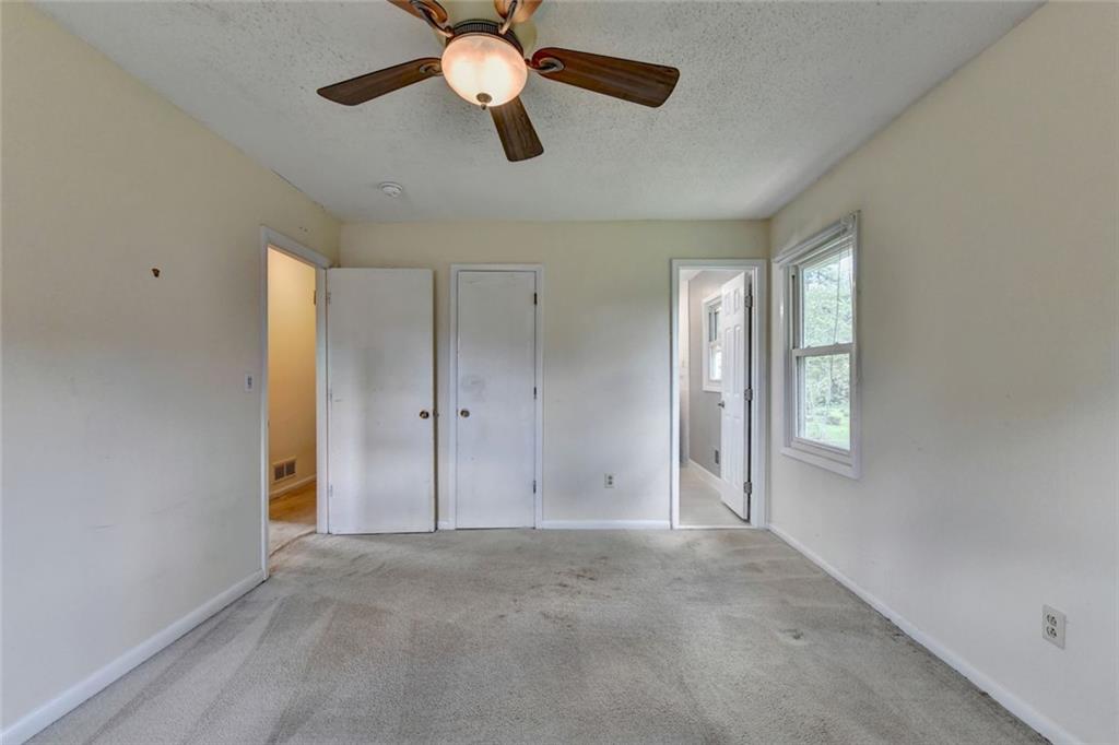1577 Harbour Oaks Road Tucker, GA 30084 - Photo 29 of 58 an empty room with windows and fan
