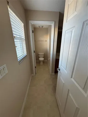 a view of an empty room with a closet