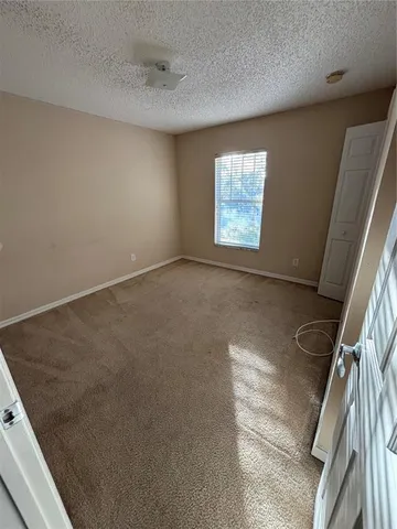 a white toilet sitting next to a bath tub