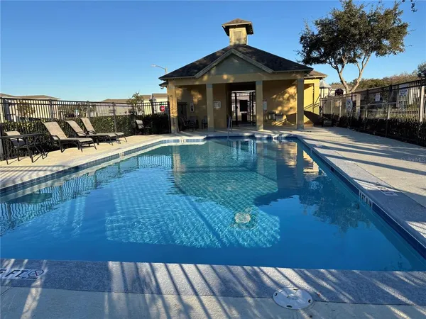a view of a house with swimming pool