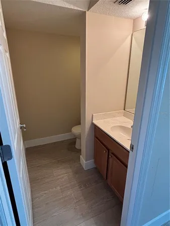 a view of bathroom with a sink and toilet