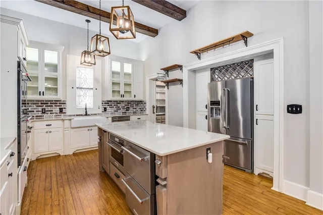 a utility room with sink dryer and washer