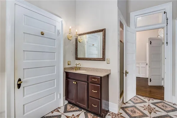 a bathroom with a toilet a window and a shower