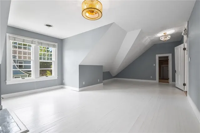 a view of empty room with a fireplace