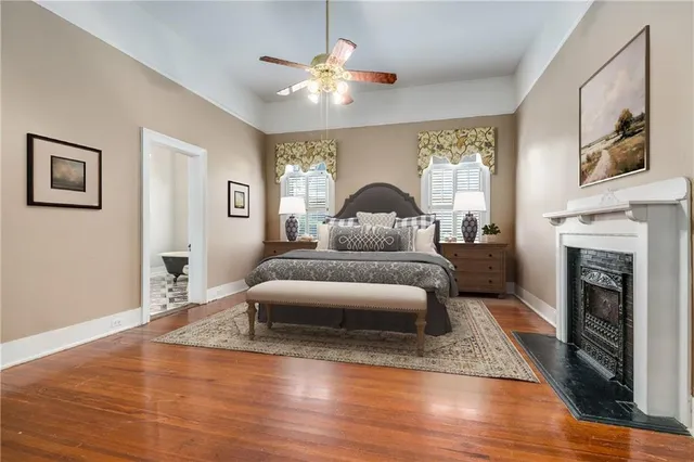 a spacious bathroom with a granite countertop double vanity sink mirror and toilet