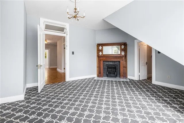a front view of house with yard and trees