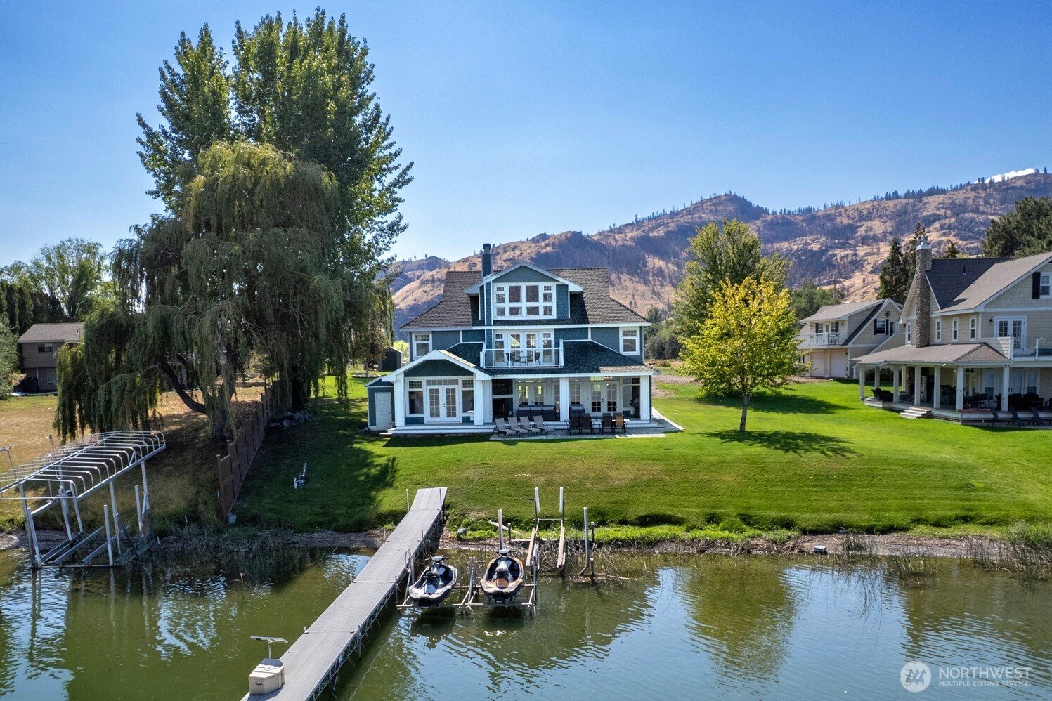 a view of a lake with a house in the background