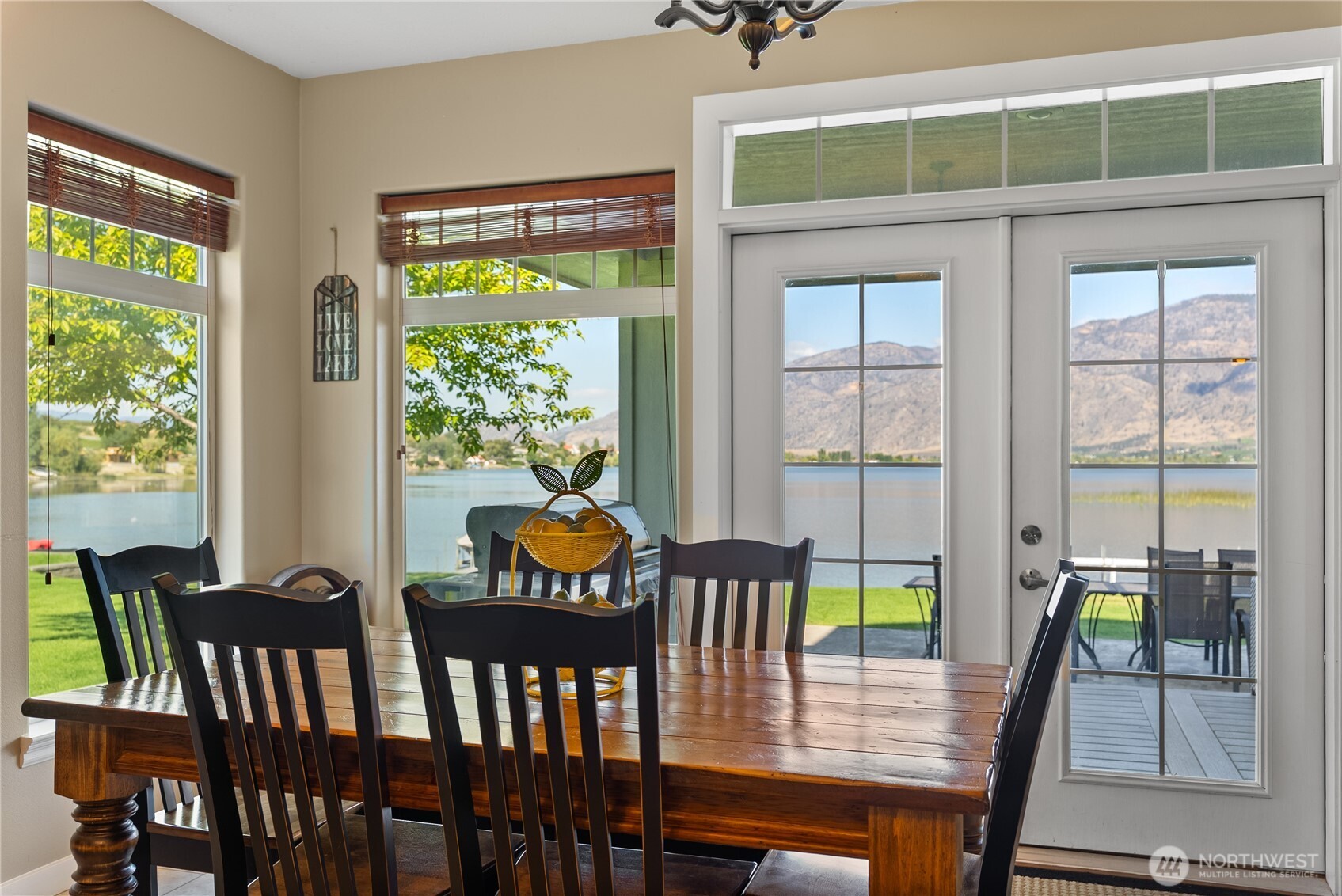 72 Boundary Point Road Oroville, WA 98844 - Photo 11 of 40 a view of a dining room with furniture window and outside view