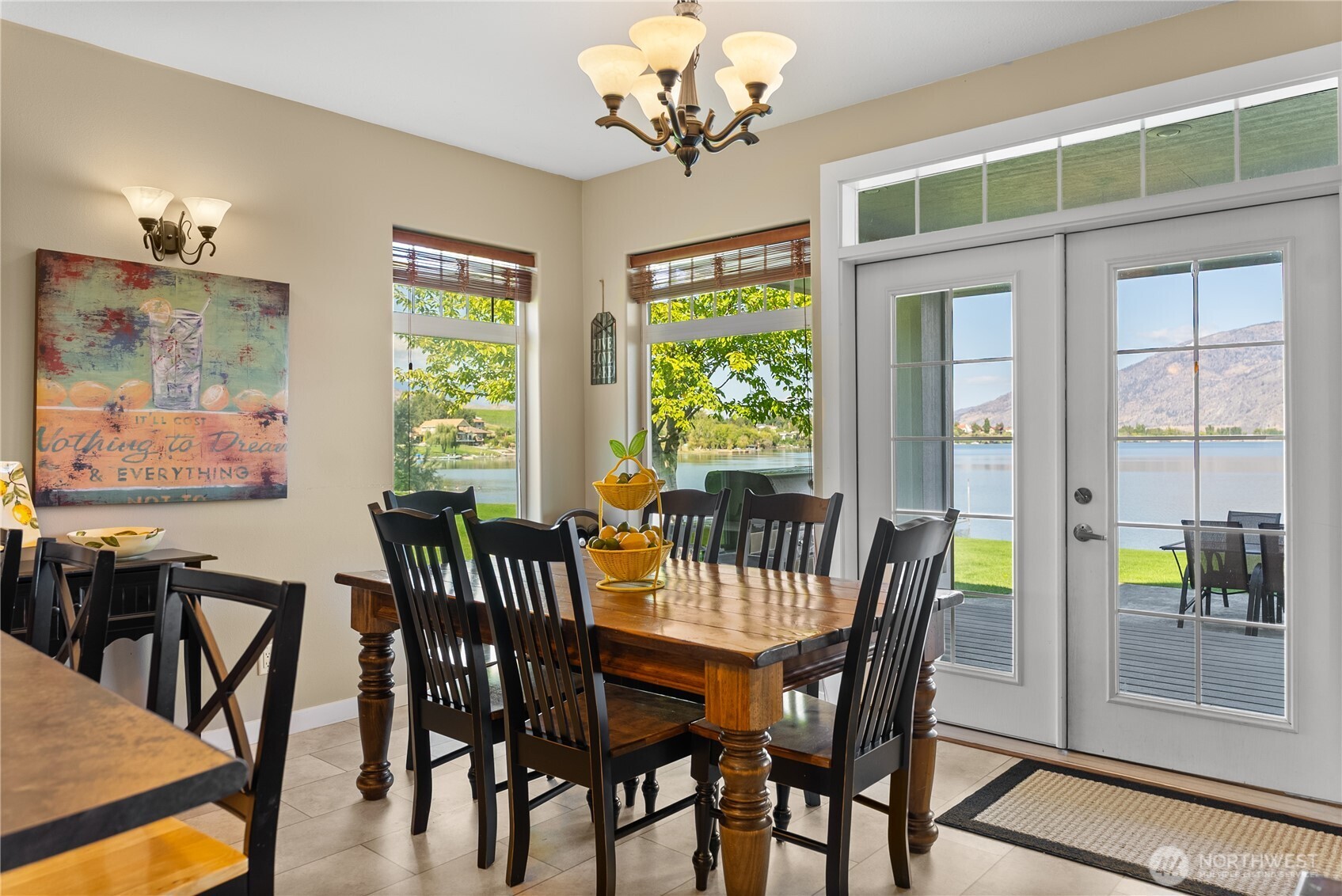 72 Boundary Point Road Oroville, WA 98844 - Photo 12 of 40 a view of a dining room with furniture a chandelier and wooden floor