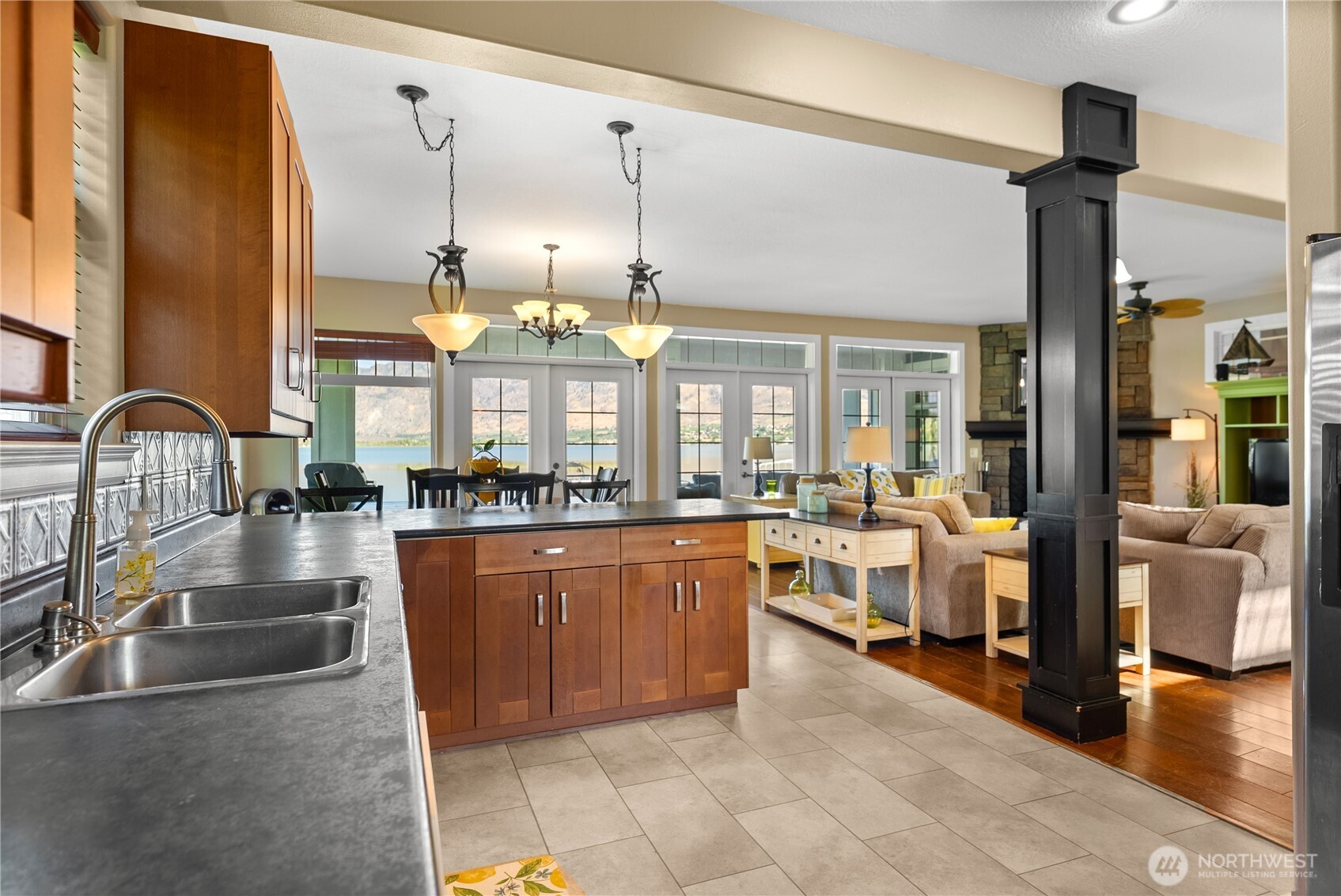 72 Boundary Point Road Oroville, WA 98844 - Photo 13 of 40 a large kitchen with lots of counter space and glass windows