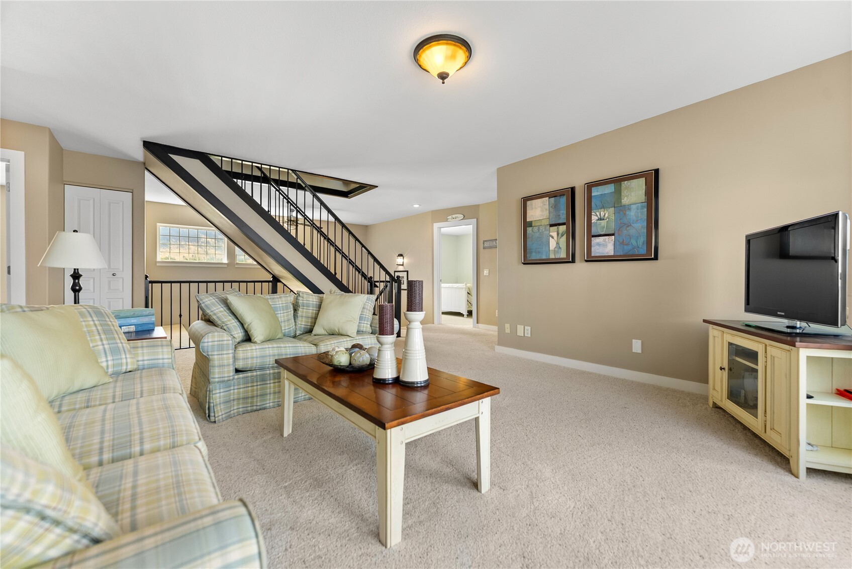 72 Boundary Point Road Oroville, WA 98844 - Photo 19 of 40 a living room with furniture and a flat screen tv