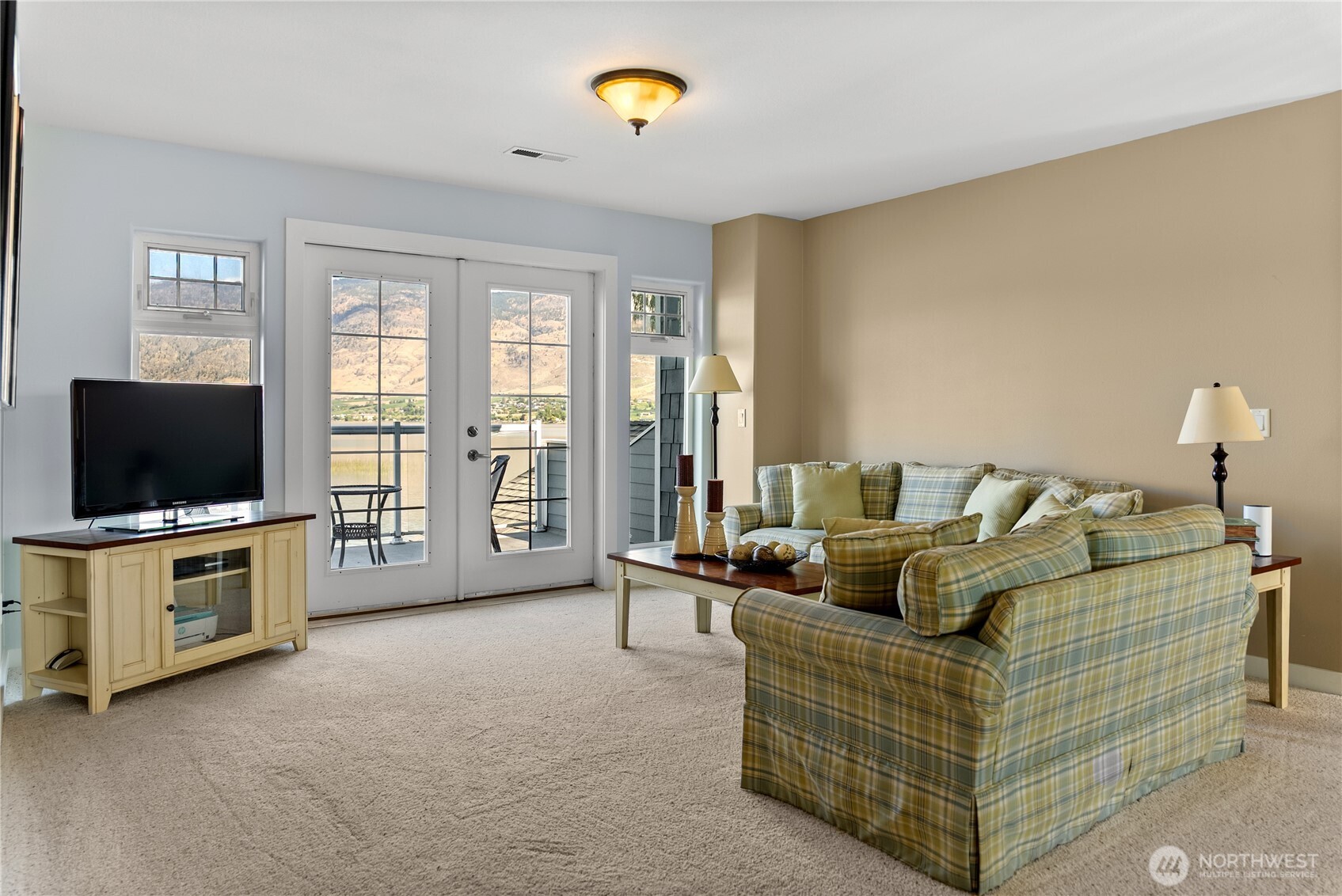 72 Boundary Point Road Oroville, WA 98844 - Photo 20 of 40 a living room with furniture and a flat screen tv