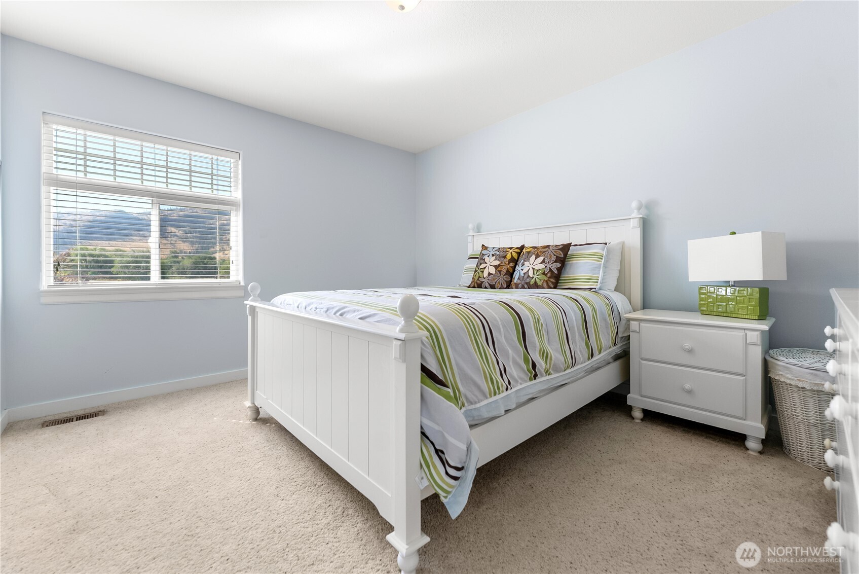 72 Boundary Point Road Oroville, WA 98844 - Photo 21 of 40 a bedroom with a bed dresser and a window