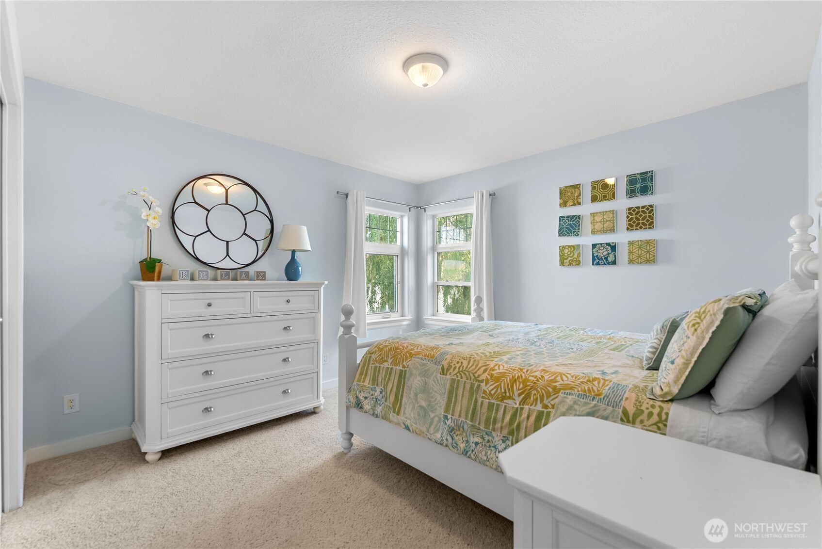 72 Boundary Point Road Oroville, WA 98844 - Photo 27 of 40 a bedroom with a bed and a window