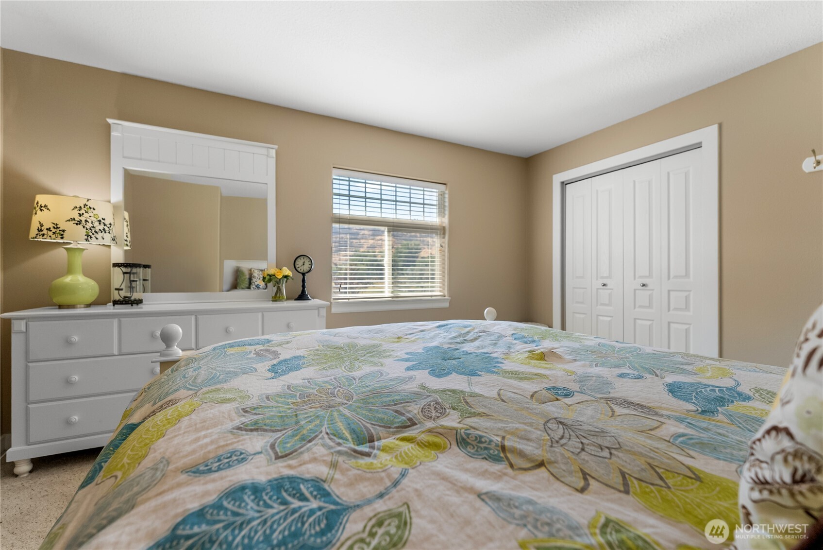72 Boundary Point Road Oroville, WA 98844 - Photo 29 of 40 a bedroom with a bed and cabinets