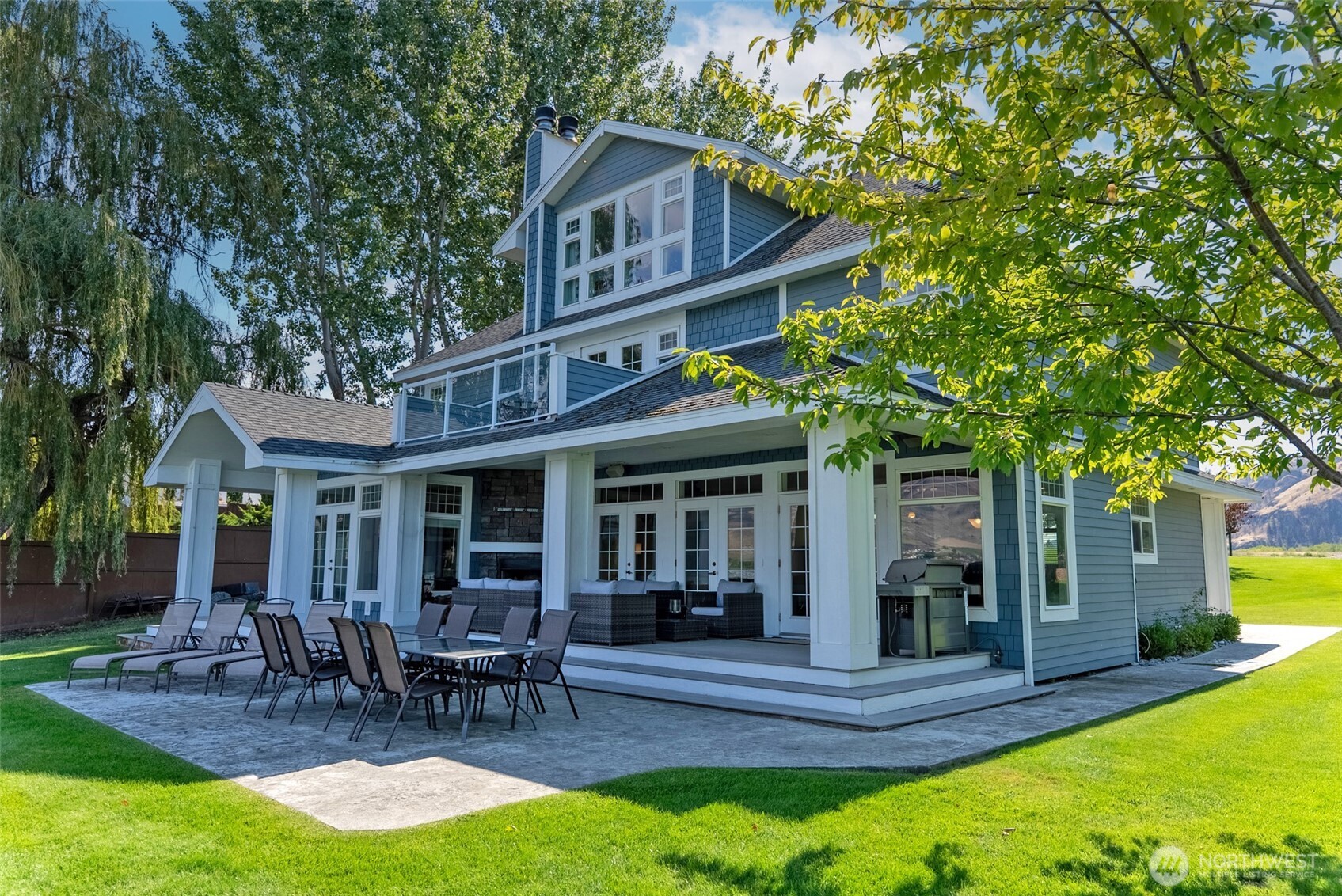 72 Boundary Point Road Oroville, WA 98844 - Photo 33 of 40 a view of a house with backyard and sitting area