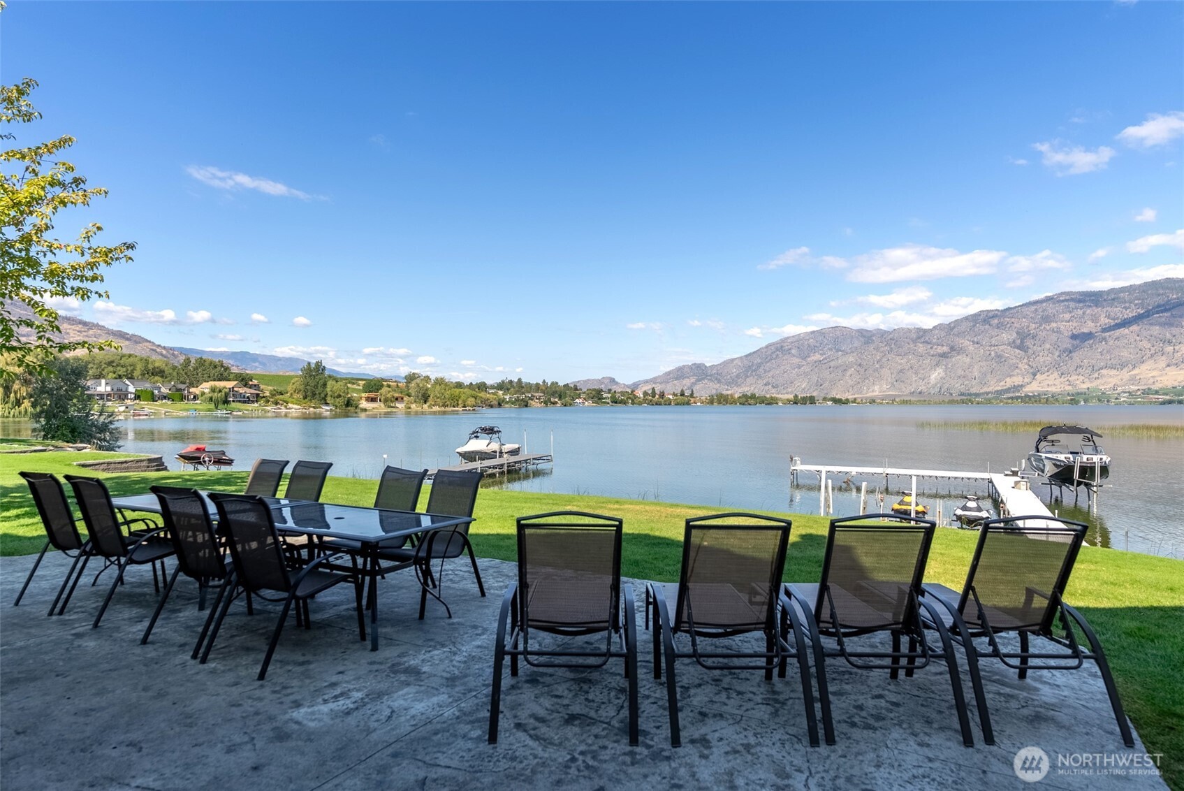 72 Boundary Point Road Oroville, WA 98844 - Photo 36 of 40 a view of chairs and table in a patio