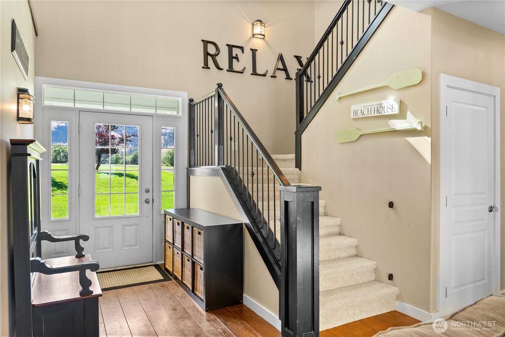 72 Boundary Point Road Oroville, WA 98844 - Photo 6 of 40 a view of an entryway with wooden floor windows and a chandelier