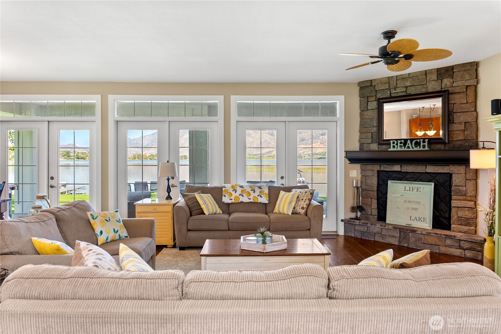 72 Boundary Point Road Oroville, WA 98844 - Photo 10 of 40 a living room with furniture and a fireplace