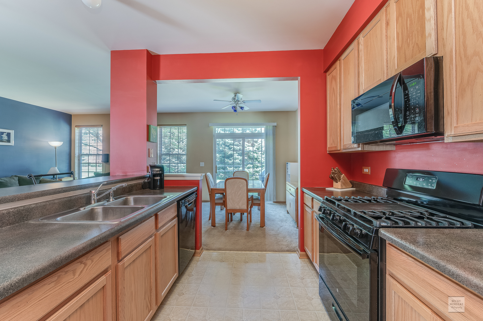 357 Grape Vine Trail Oswego, IL 60543 - Photo 5 of 27 a kitchen with stainless steel appliances granite countertop a stove a sink and a microwave