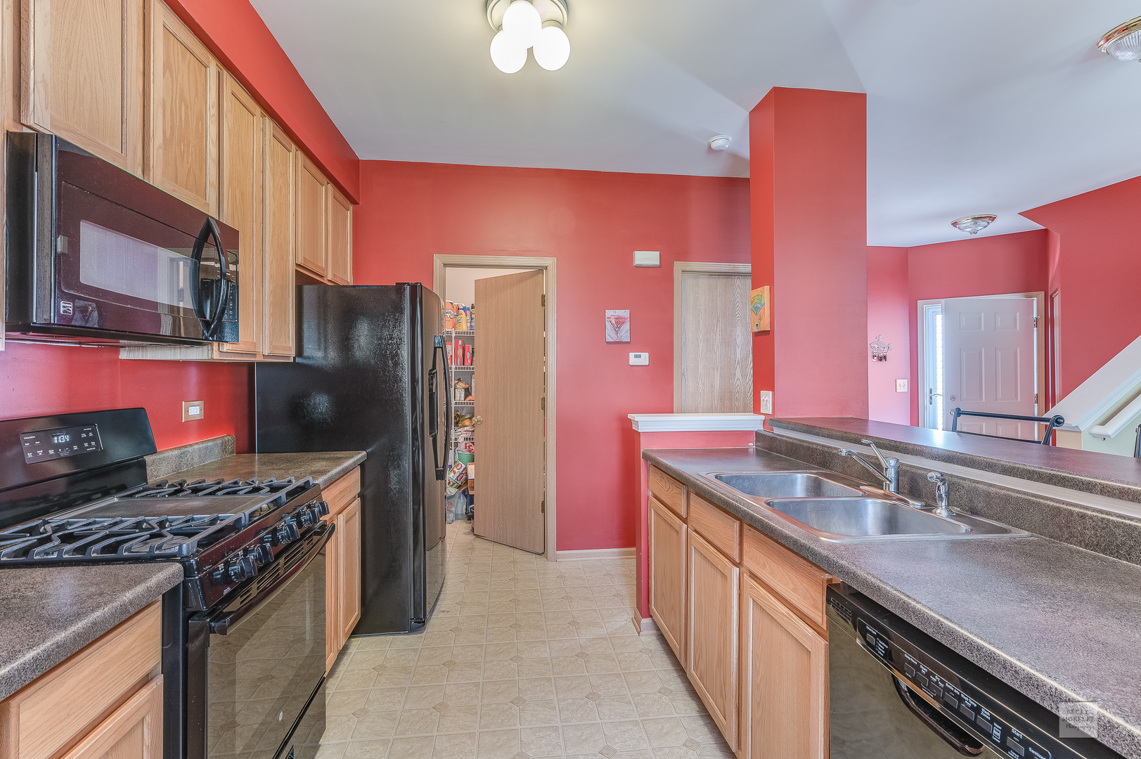 357 Grape Vine Trail Oswego, IL 60543 - Photo 6 of 27 a kitchen with stainless steel appliances granite countertop a stove a refrigerator and a sink
