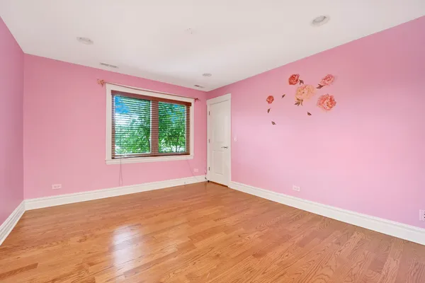 a view of an empty room with windows