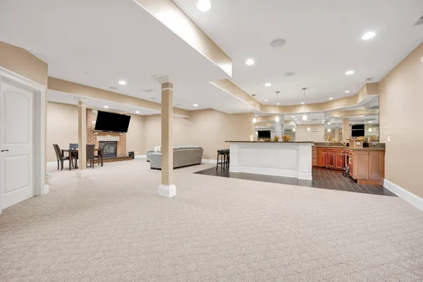 a large kitchen with a sink and cabinets