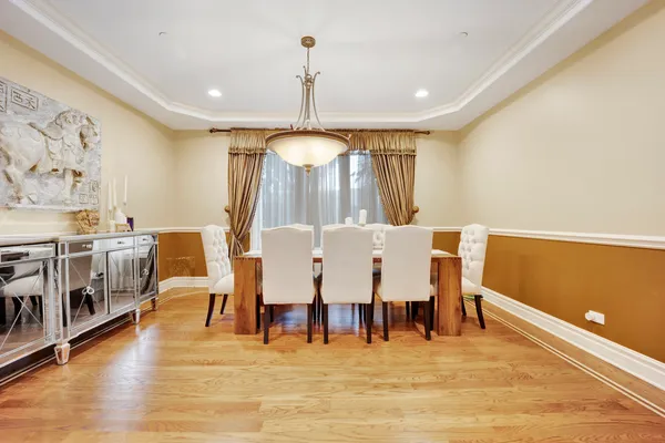 a view of dining room with furniture and wooden floor