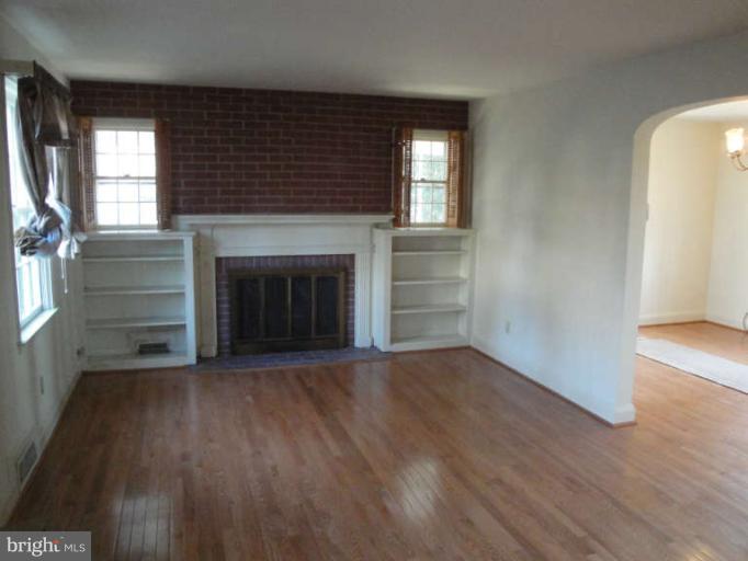 800 Olmstead Road Baltimore, MD 21208 - Photo 8 of 23 Living Room With Fireplace & Built-ins