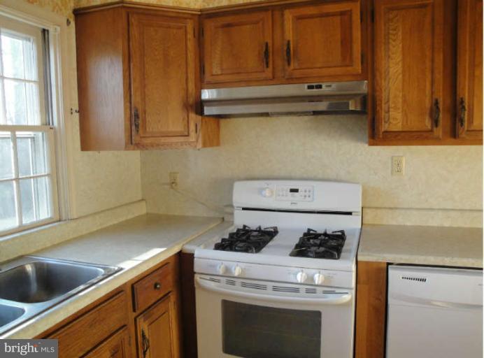 800 Olmstead Road Baltimore, MD 21208 - Photo 10 of 23 Kitchen With Stove & Dishwasher