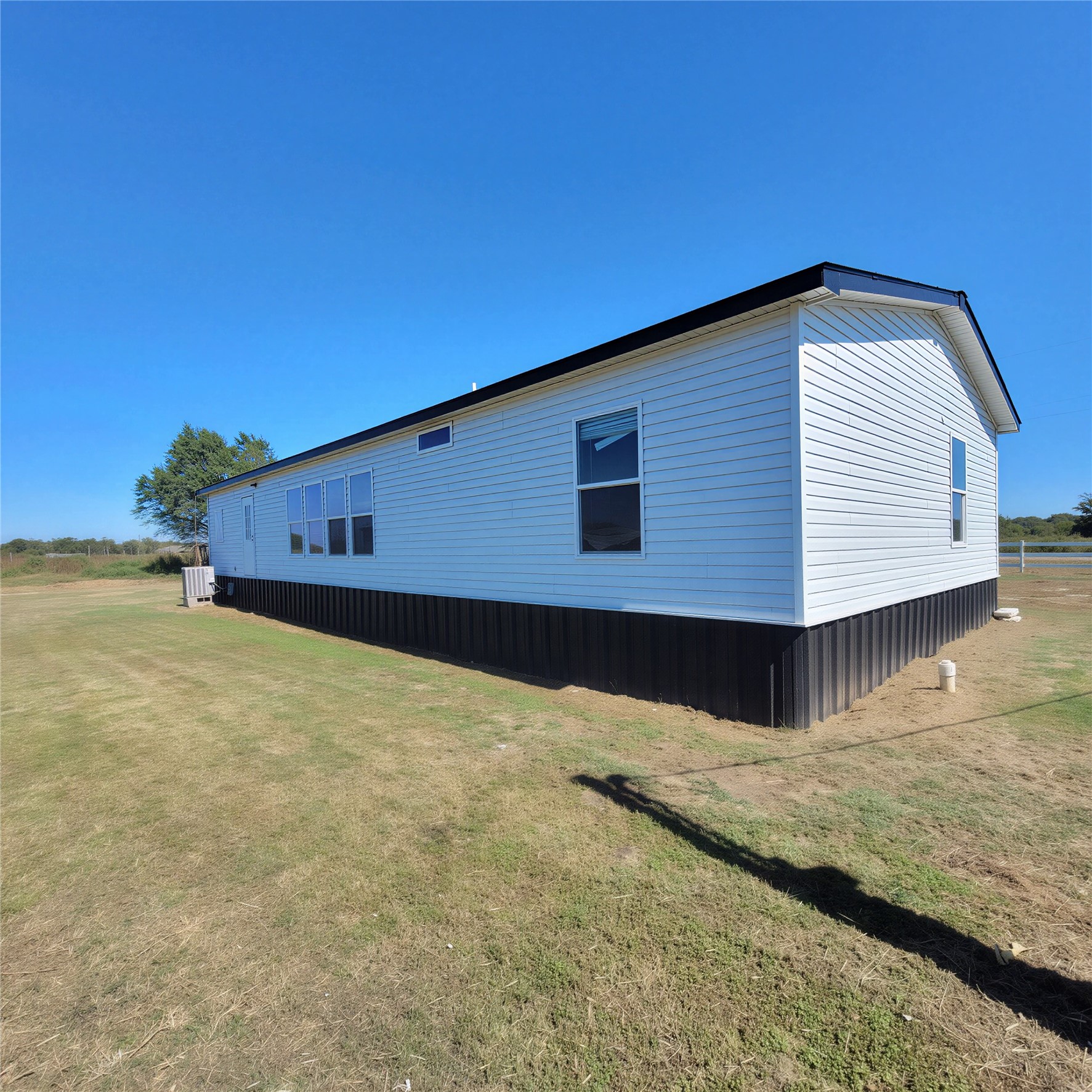 740 County Road 164 Boling, TX 77420 - Photo 2 of 16 a view of an house with backyard