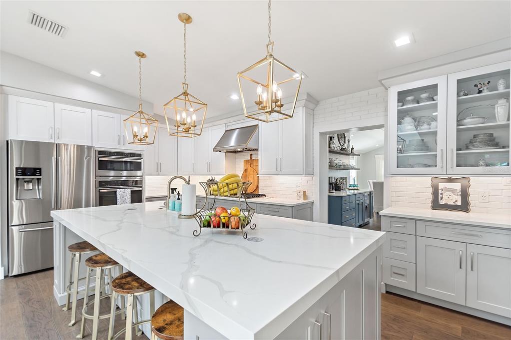 640 Arjay Way Winter Park, FL 32789 - Photo 14 of 46 a kitchen with a sink a counter space appliances and cabinets