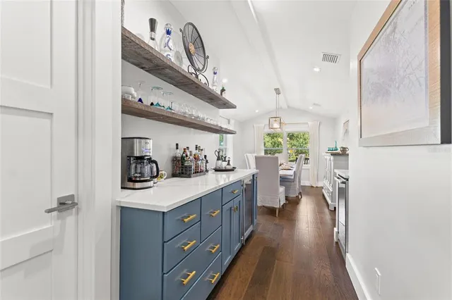 a bathroom with a sink a mirror and a shower